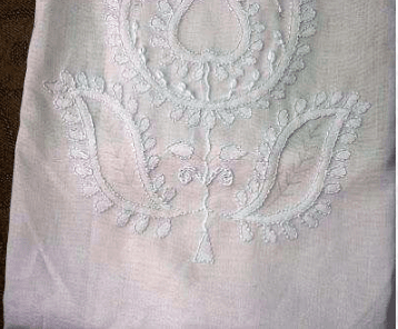 A detailed view of Bhakhiya stitch, also known as shadow work, showcasing its delicate, airy embroidery effect on fabric.