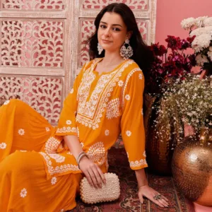 Brighten up your festivities with this Yellow Modal Chikankari Garara Set, featuring delicate ghaspatti and floral hand embroidery on a soft, flowy fabric.