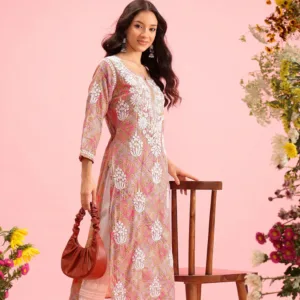 The Gulnaar Chikankari Kurta pairs a charming pink print with intricate hand embroidery on breezy mulmul cotton—designed for comfort, crafted for admiration.